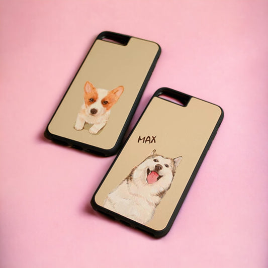 Customizable iPhone case crafted from leather, adorned with a hand-painted portrait of brown and white dogs against a pink background.