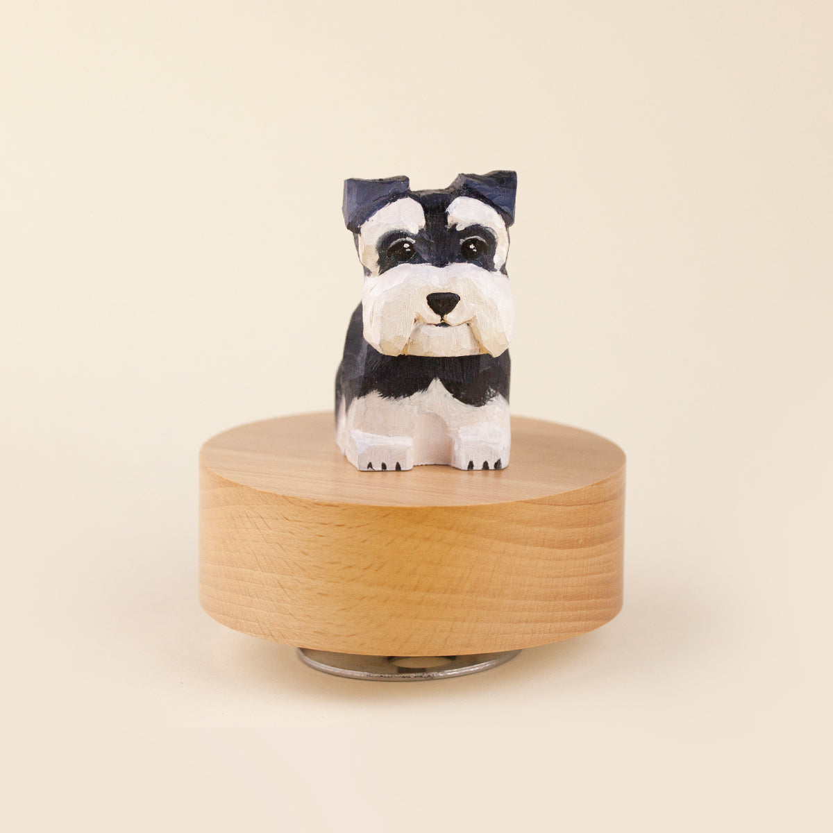 Custom hand-painted black and white dog figurine on a round wooden base