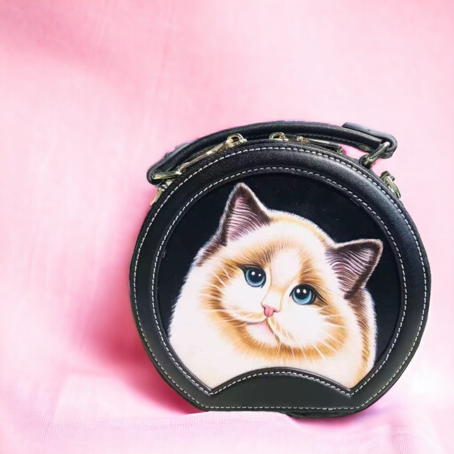 Black round leather handbag with a hand-painted cat portrait in a Japanese style.
