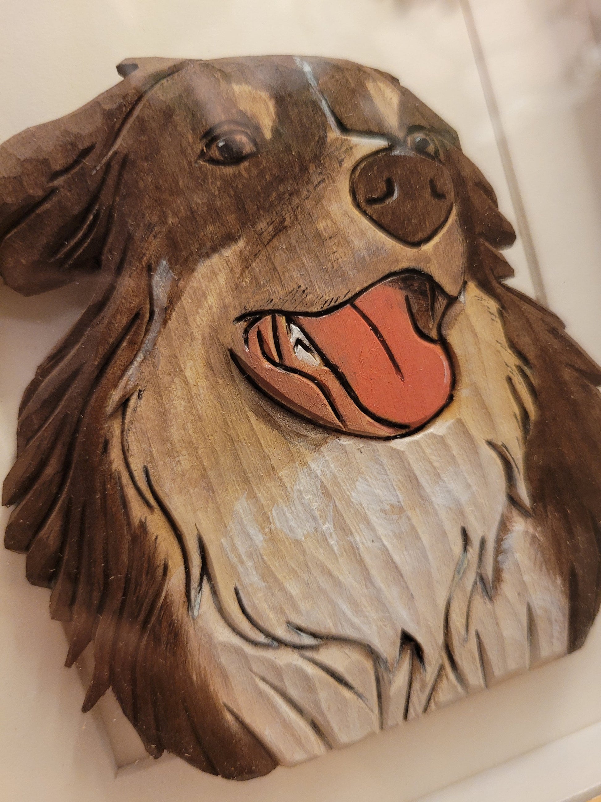 Close-up of intricate details of personalize handcrafted wood carving pet portrait