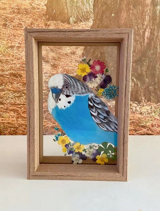 Personalized glass painting of a smiling corgi, hand-painted and framed in wood.