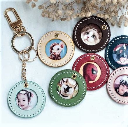 Variation of customizable handcrafted keychain of portraits in different colors.