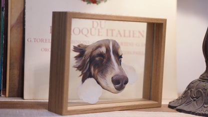 Custom hand-painted black dog portrait on glass with a wooden frame, adorned with colorful flowers.