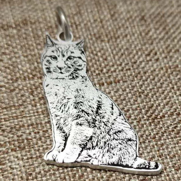 Sterling silver custom engraved cat portrait pendant, showcasing intricate details and high-quality craftsmanship.