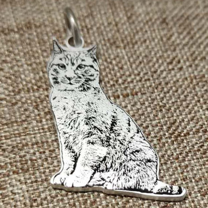 Sterling silver custom engraved cat portrait pendant, showcasing intricate details and high-quality craftsmanship.