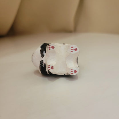 Hand-painted custom pet portrait keychain featuring a cute dog with beads on a black cord, bottom view showing paw prints.