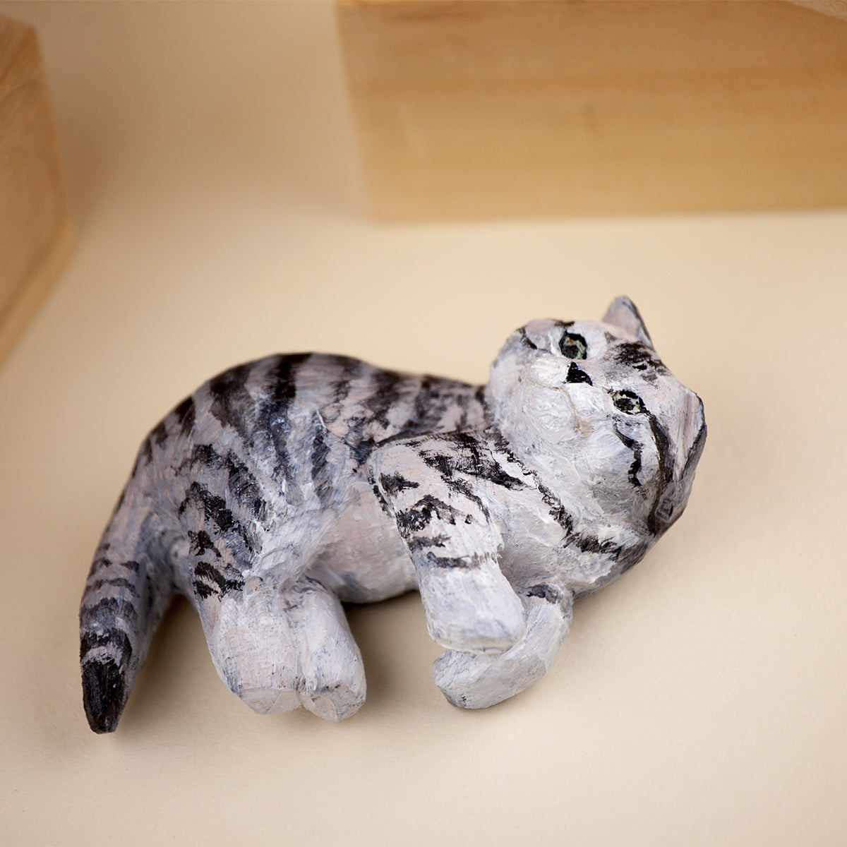 Custom hand-painted wooden cat figurine lying down