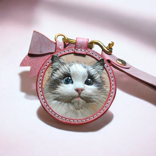 Hand-carved leather keychain featuring a detailed 3D portrait of a cat, personalized and crafted from high-quality leather.