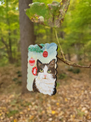 Handmade cat portrait Christmas ornament for tree decor, painted on a wooden tag.