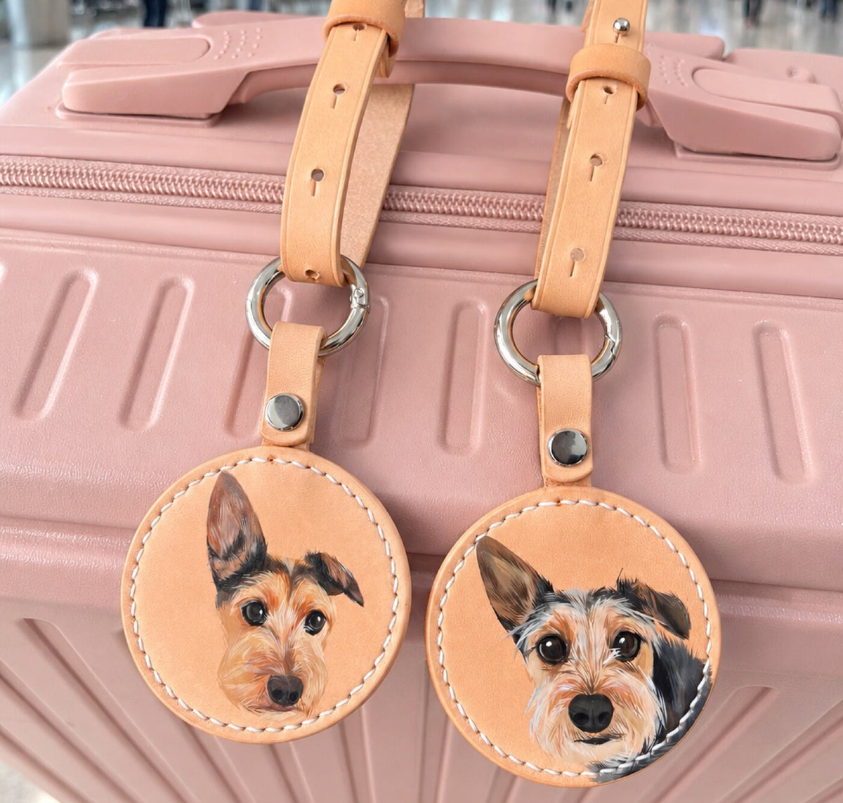 Two leather luggage tags hand-painted with dog portraits