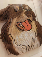 Close-up of intricate details of personalize handcrafted wood carving pet portrait