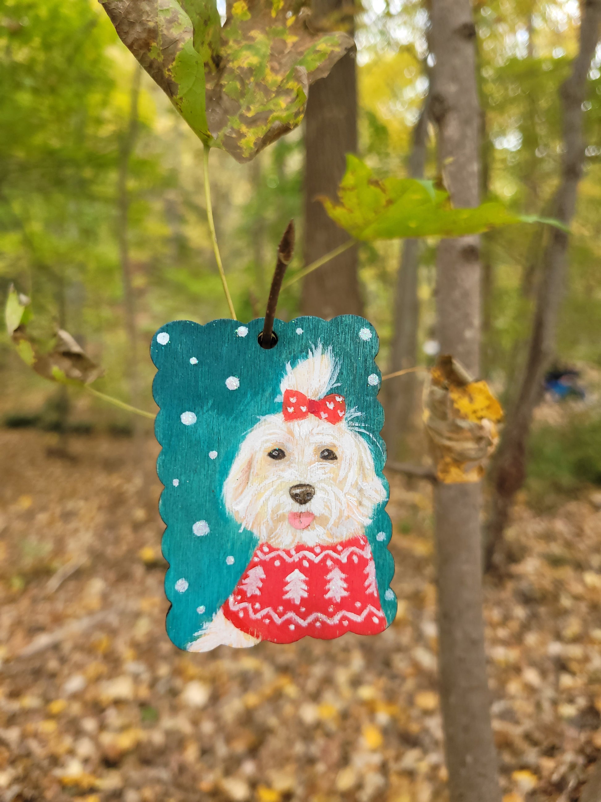 Dog portrait holiday ornament wood tag with a festive snowy background.