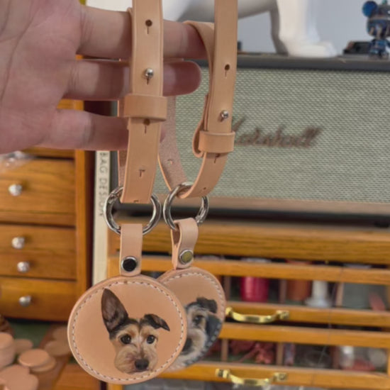 A video demonstrating a custom hand-painted leather luggage tag with a pet portrait, showing the craftsmanship and detail in the artwork.