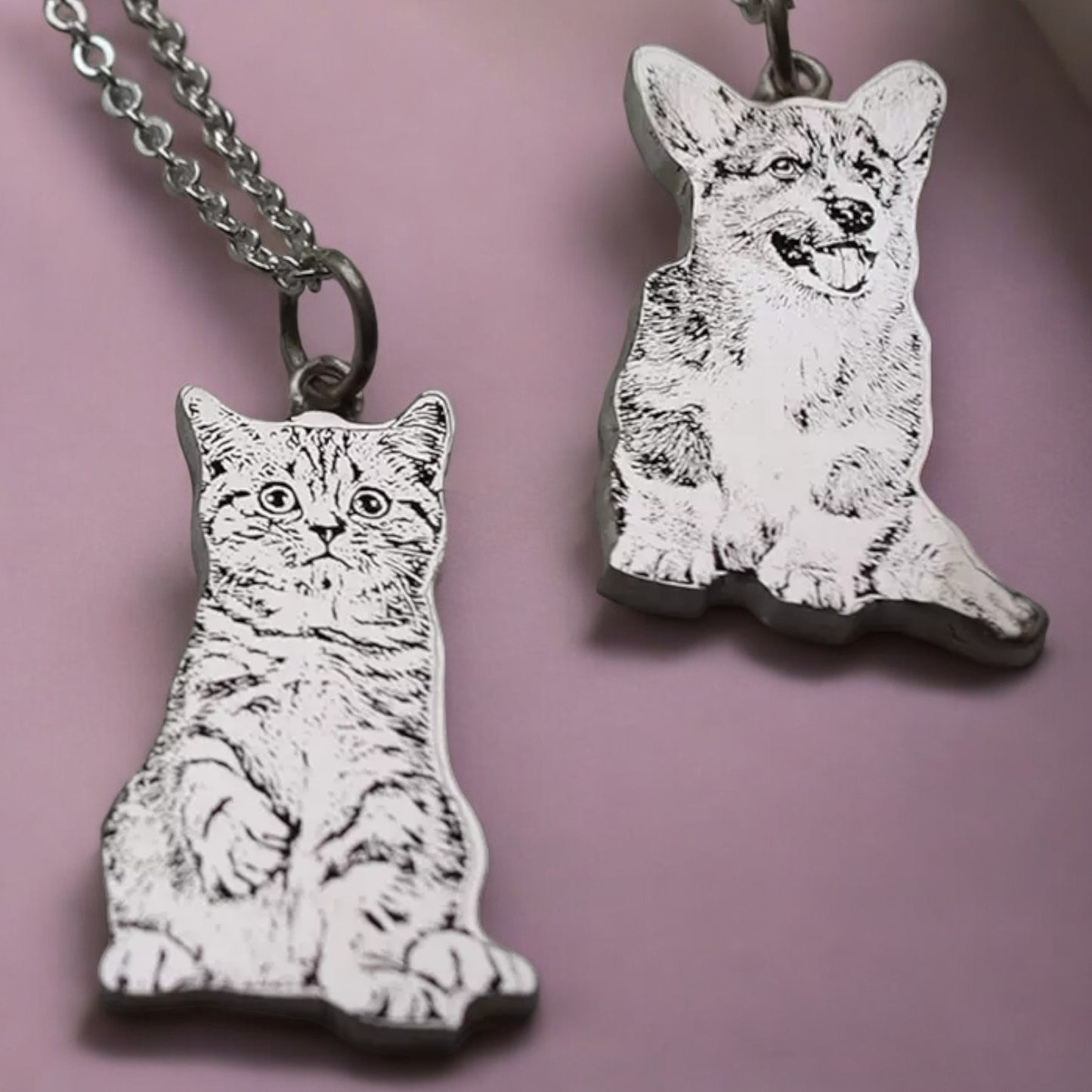 Sterling silver custom pet portrait engraving necklaces featuring a cat and a dog, beautifully detailed and perfect for pet lovers.