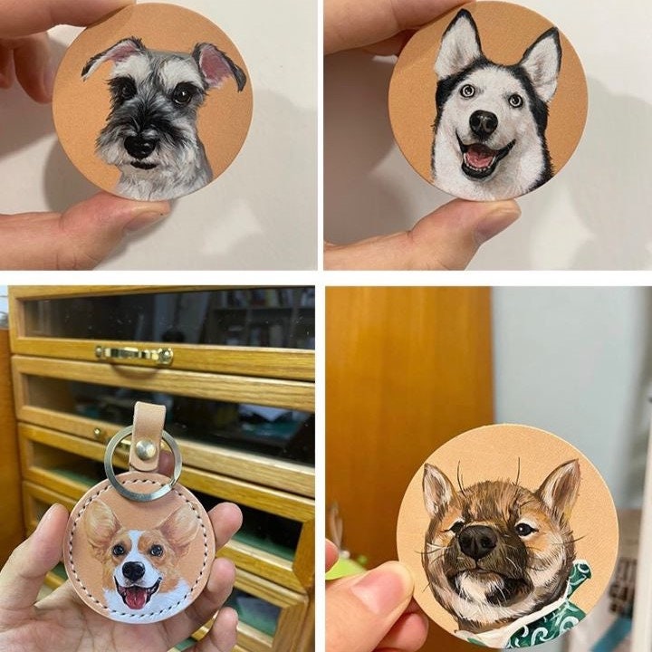 Multiple dog handpainted leather keychains with various pet portraits, displayed in a grid pattern