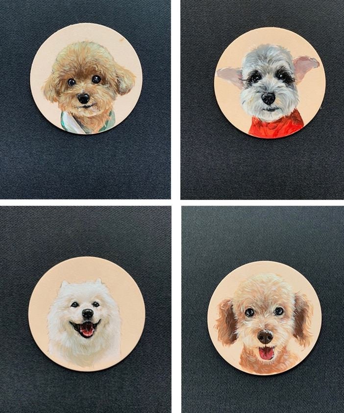 Multiple dog handpainted leather keychains with various pet portraits, displayed in a grid pattern