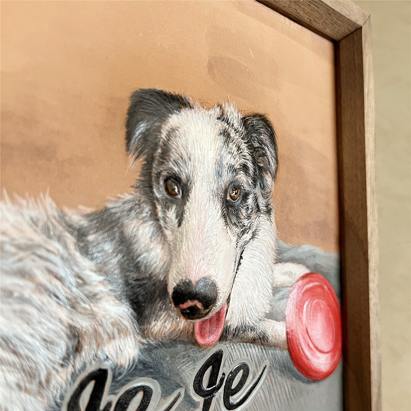 Side angle view of the custom pet portrait hand-carved leather frame with the name 'Le Le'