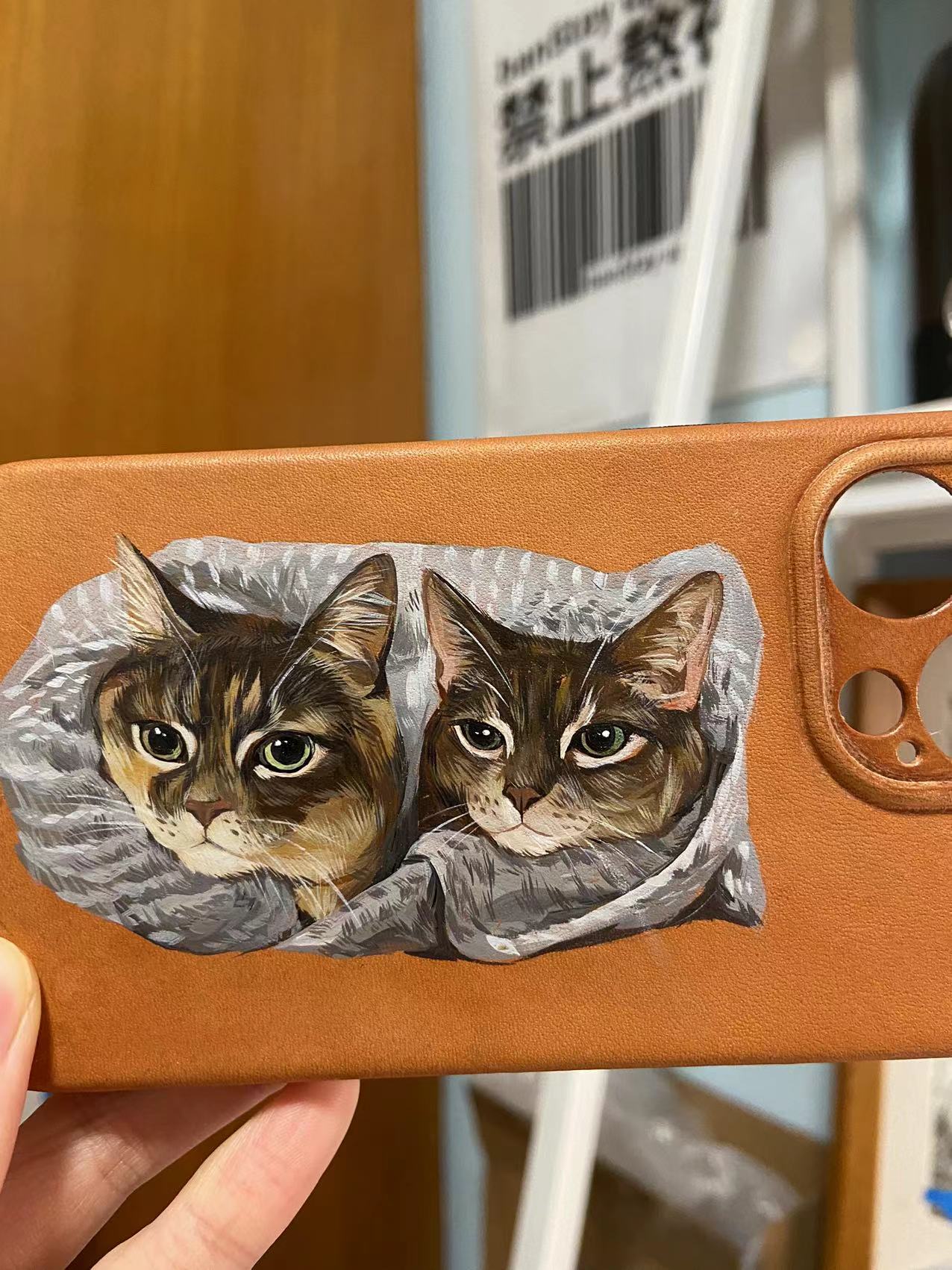 Personalized hand-painted pet portrait of 2 cats on vegan leather phone case.