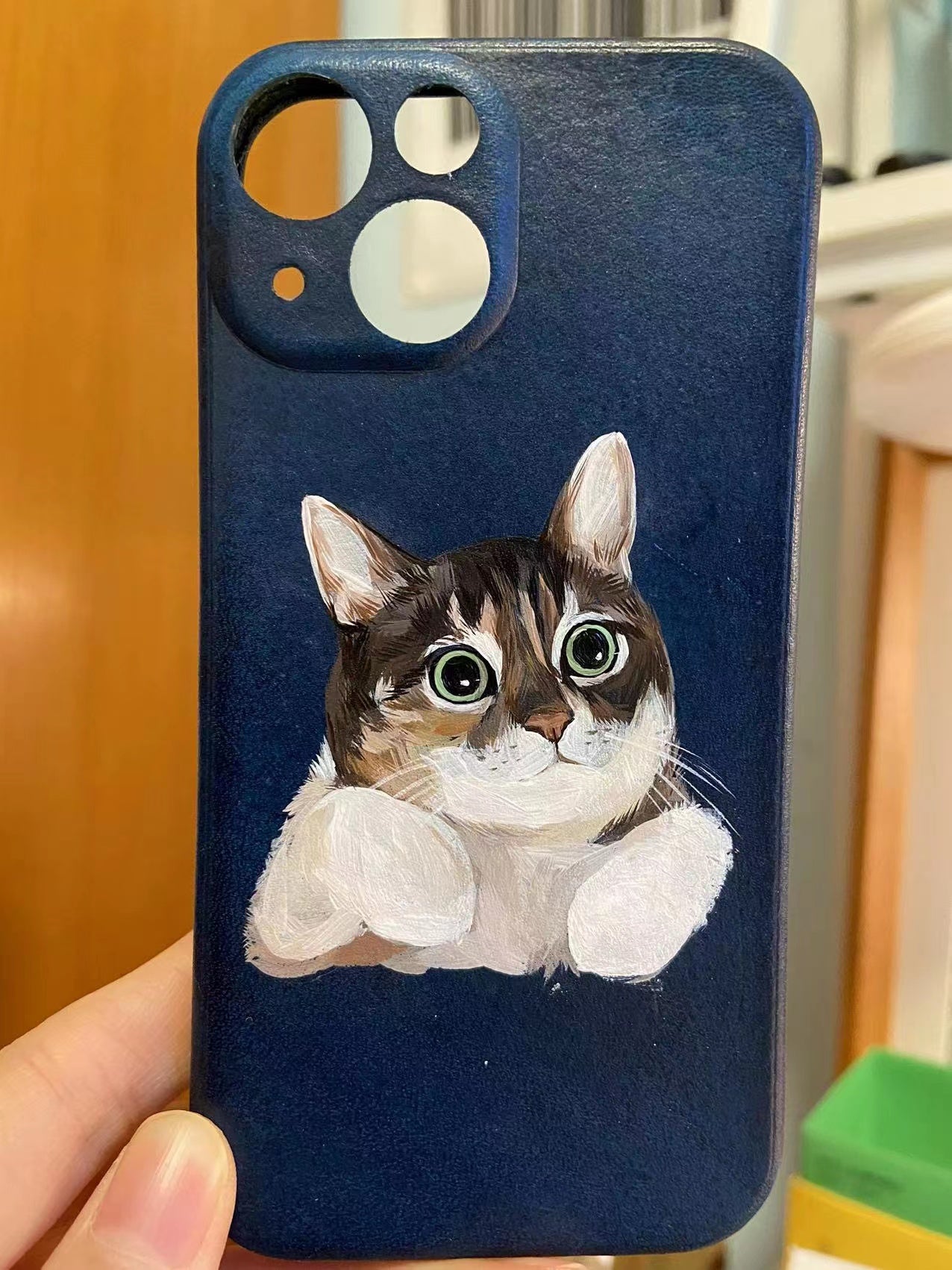 Personalized hand-painted pet portrait of a cat on vegan leather.